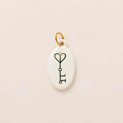 Hand painted enamel flower and kitten charm