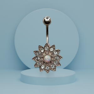 Golden daisy-shaped earrings with opal center and intricate crystal-studded petals, hanging elegantly from a gold stud