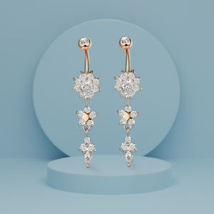 Rose Radiant Star earrings with intricate crystal snowflake-inspired designs, elegantly dangling from a polished Golden stud.